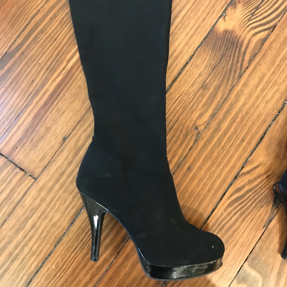 Black knee high heeled boots
